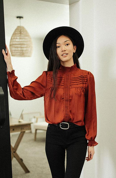 red high neck blouse with lace detail